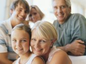 Family smiling, portrait (focus on grandmother and girl (7-9))