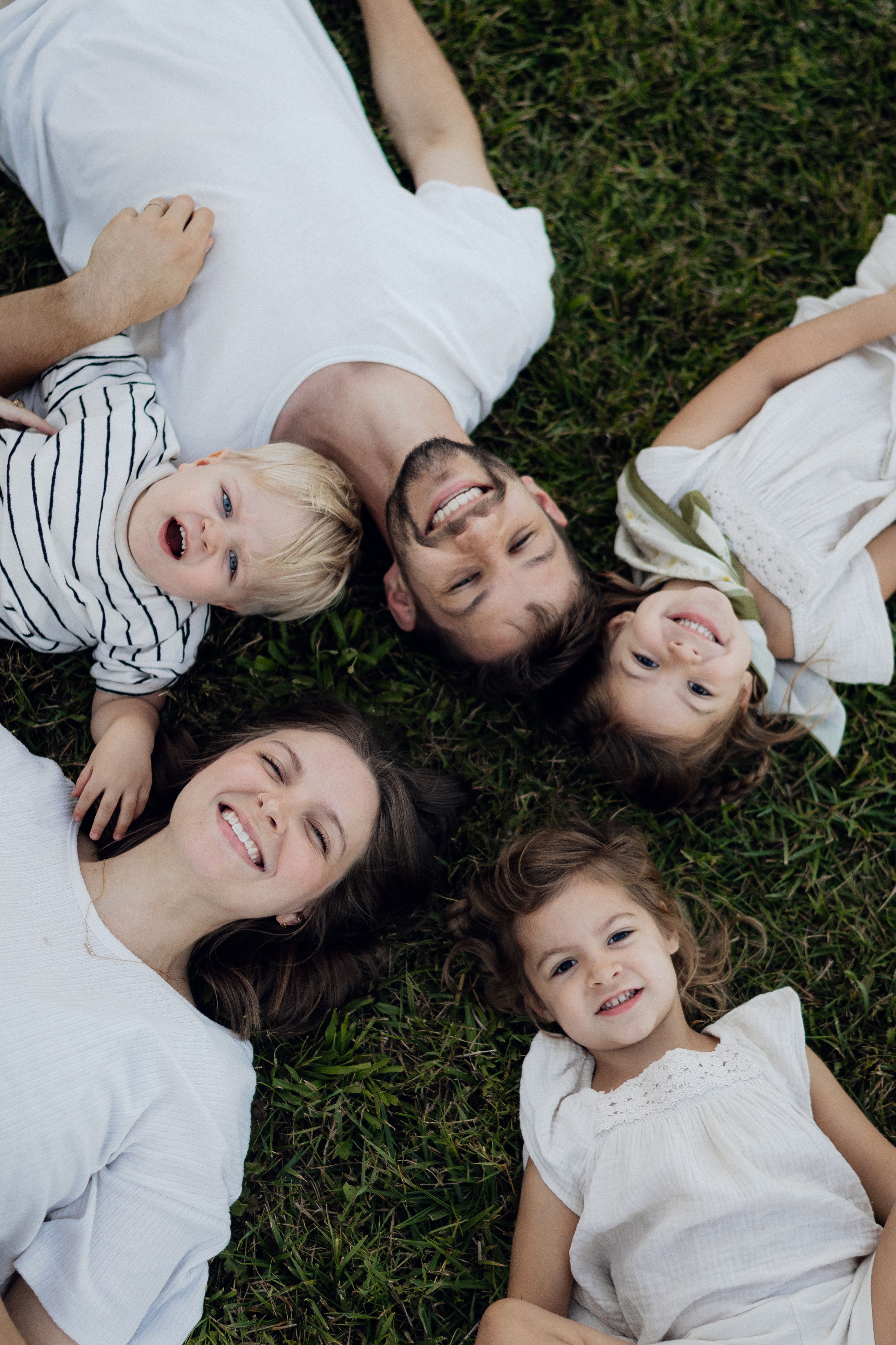 Family relaxing together on the grass